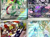 several pokemon cards are displayed on a table in front of a window