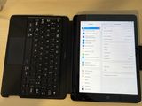 two laptops sitting next to each other on a desk