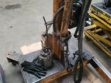 a machine that is sitting on a table in a garage