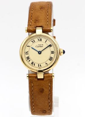 a close up of a wrist watch with roman numerals on it
