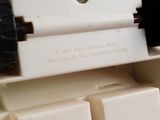 a close up of a white electrical device on a table