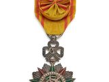 l'image d'une médaille surmontée d'une étoile