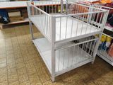 a baby crib in the middle of a store
