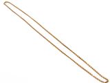 a close up of a gold necklace with a chain on a white background