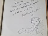 a drawing of a woman in a dress on a piece of paper