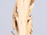 an image of a wooden sculpture of a bird perched on a branch
