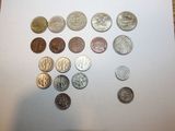 a lot of coins that are on the table