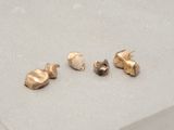 three different types of ear piercings sitting on a table