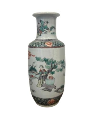 a vase with a painting on it sitting on a table