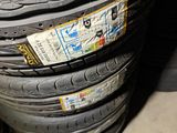 tires stacked on top of each other in a garage