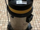 a vacuum that is sitting on the floor in the hallway