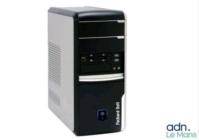 the desktop computer is sitting on a white surface with a black keyboard