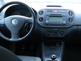 a dashboard of a car with a steering wheel and dashboard controls