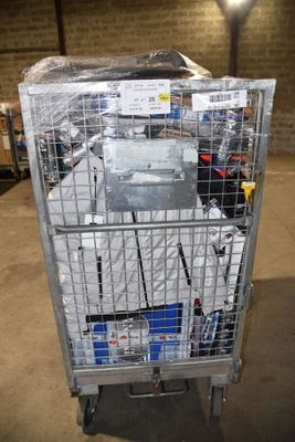 a metal cart with many items in it in a warehouse