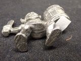 a silver object that is laying on the ground