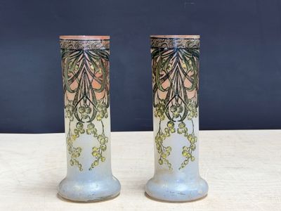 two vases that are sitting on a table
