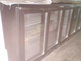 an image of a refrigerator with glass doors in a kitchen