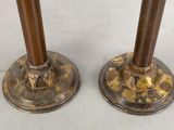 pair of antique brass candlesticks on marble bases