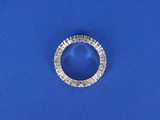 a close up of a diamond ring on a blue surface