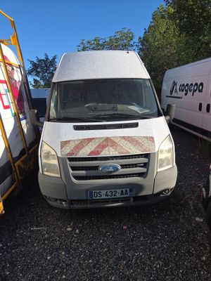 a white van that is parked next to a white van