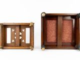two small wooden frames with decorative designs on them against a white background