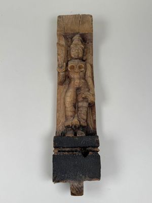 an image of a wooden sculpture of a man holding a child