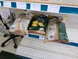 two bags of bread sitting on a shelf in a store