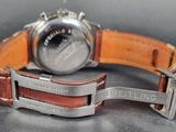 a close up of a wrist watch with a leather band