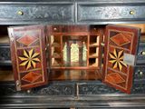 a wooden cabinet with a clock inside of it