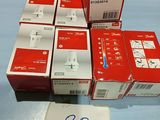 several boxes of red and white electronic devices on a blue surface