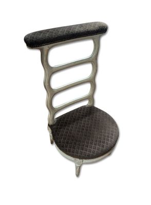 a black and white chair with a black seat on it