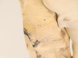 a close up of a statue of a person with a glove on