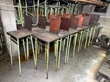 many chairs that are lined up in a room