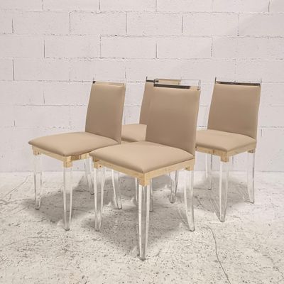 Ensemble de 4 chaises design en plexiglass, metal doré et tissu. Bon é