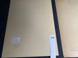 two papers that are sitting on a table