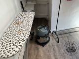 a ironing board sitting on top of an ironing board