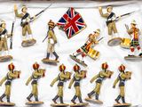 many figurines of soldiers and drummers in a display case