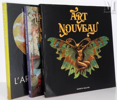 two books on a white table with a black cover and a picture of a butterfly
