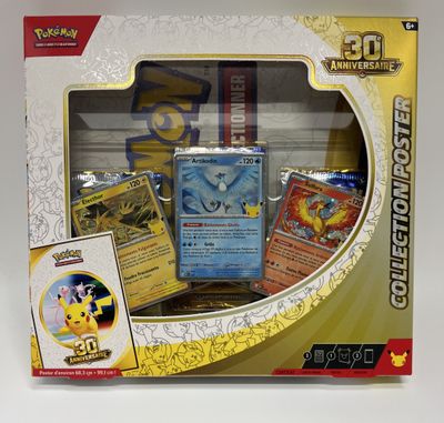 a box of pokemon cards on display on a table