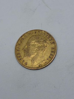 an image of a gold coin on a white surface