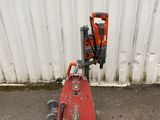 a small machine that is sitting on the side of the road