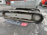 a picture of a close up of a tractor on the ground
