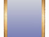 an image of a gold framed mirror on a white background