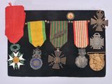 an image of a display of medals and medals on a black board