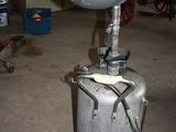 a large metal pot sitting on top of a metal tank