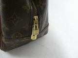 a close up of a louis vuitton bag on a white surface