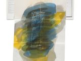 a blue and yellow painting on a piece of paper