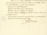 un vieux document écrit posé sur une table