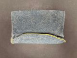 grey denim pouch with yellow zipper