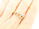 an image of a woman ' s hand with a ring on it